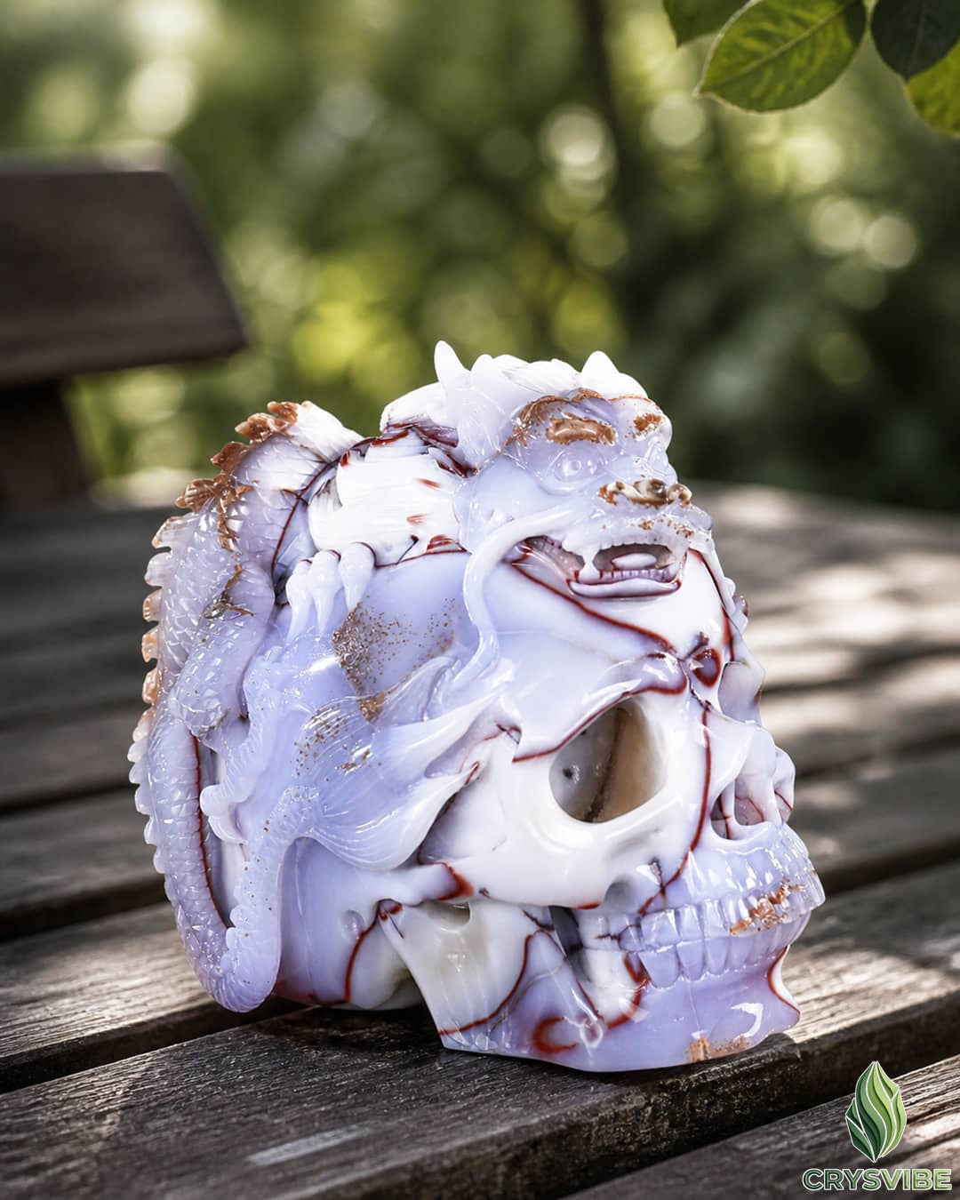 Crystal human skull sculpture with animal design from Crysvibe