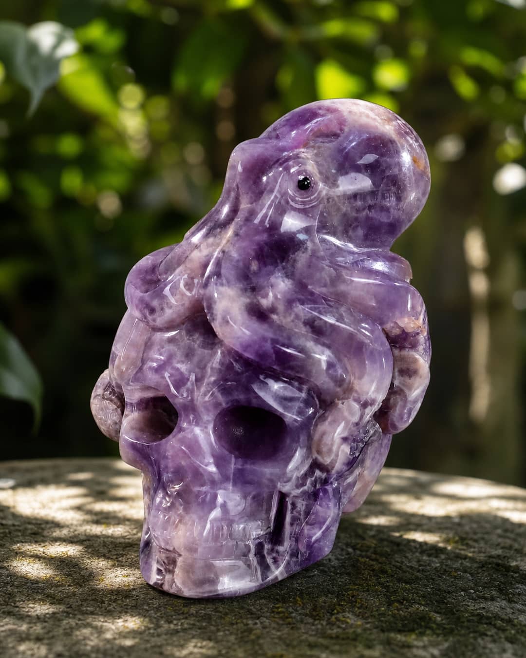 Polished crystal skull sculpture with animal figure design